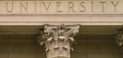 The word "University" engraved in stone